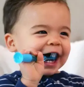 Baby brushing teeth.
