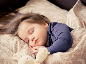 Baby sleeping on left hand side.