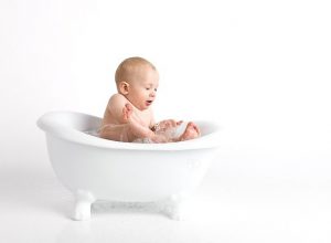 Bathing a baby.