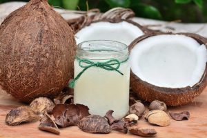 Coconuts ,coconut shells and coconut oil in jar.Quick organic foods for babies. 