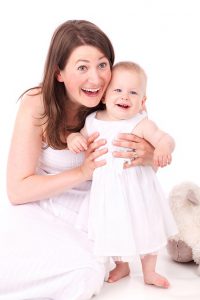 Happy mother and baby;how to make my baby poop instantly.