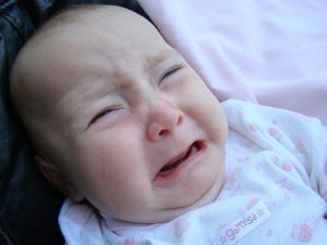 Constipated baby crying.
