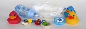 baby diaper ,toys and milk bottle in how to make baby poop instantlty.