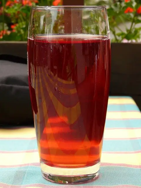 Grape juice in water glass 