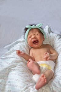 crying baby while pooping;how to make my baby poop instantly