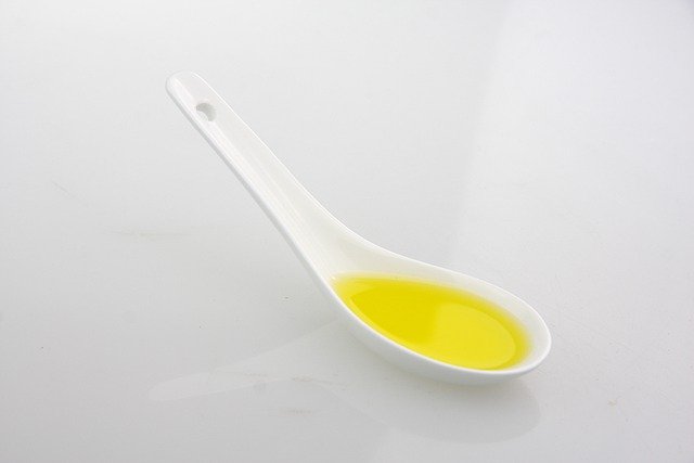 Castor oil in baby spoon 
