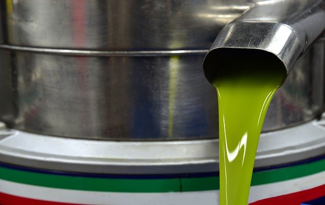 Unrefined virgin olive oil during production.