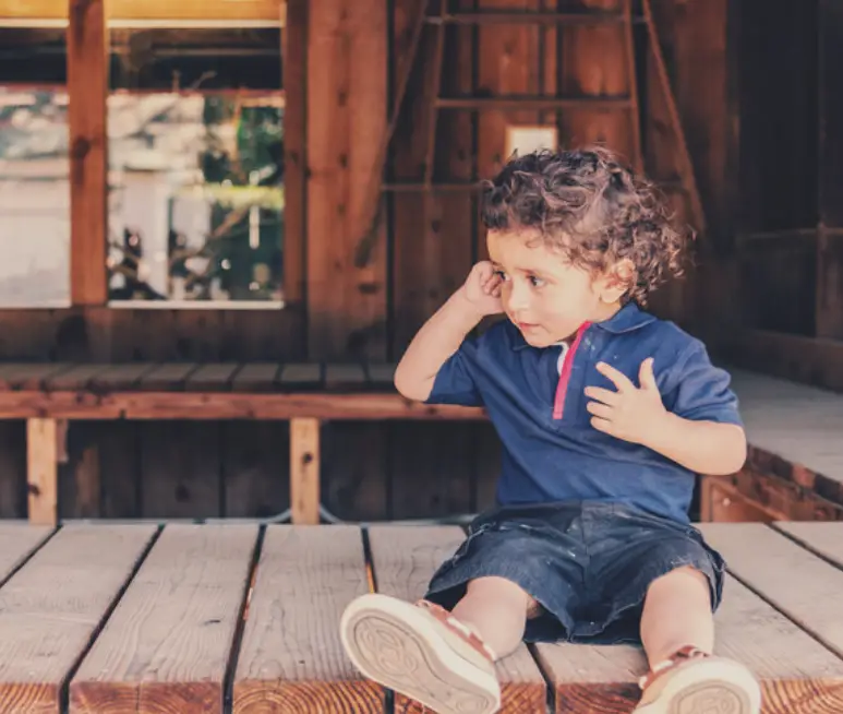 15 month old developing Baby playing alone