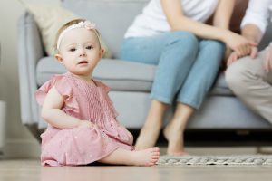 Baby girl sitting down;Cutting baby hair superstition