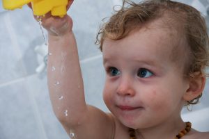 baby enjoying their bath time