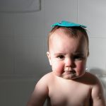 Baby taking a bath; 