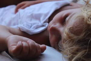 6 months old baby sleeping in baby hair growth stages  .