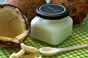 Coconut cut in half and coconut oil in jar;When does baby hair grow back after falling out .