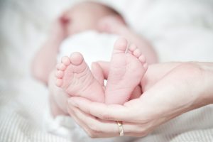 Newborn baby legnth measuring. Laid down on surface. In Average newborn length.