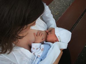 Mother breastfeeding baby; How often should a newborn poop .