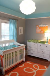 Aqua and orange baby girls room 