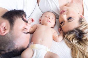 Mother,Father and baby helping to sleep comfortably 